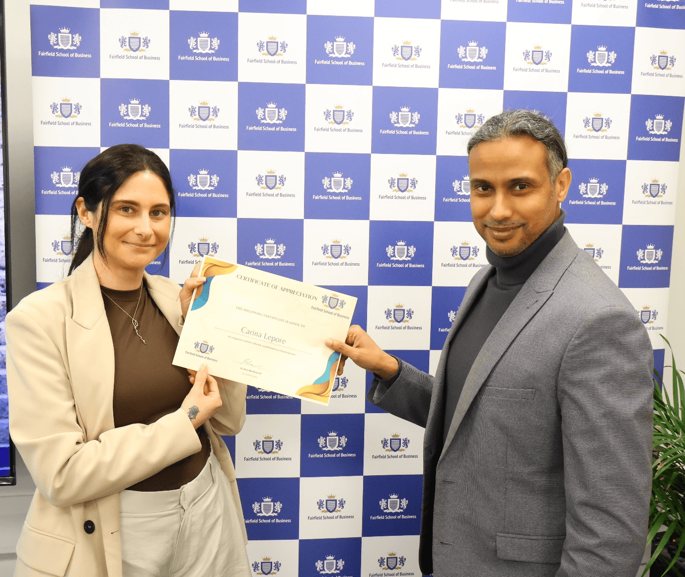 Dr Ben Abudawood presents certificate to Carina